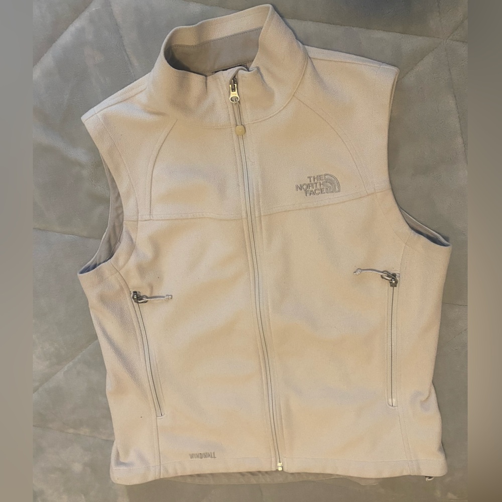 The North Face cream colored zip up vest